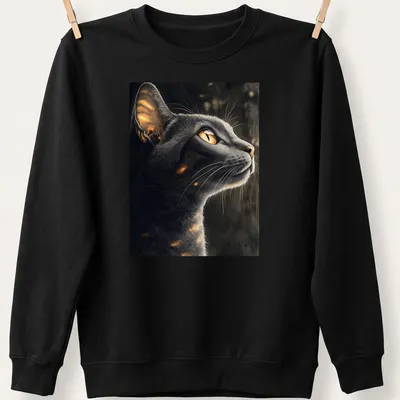 Realistic print of an Abyssinian cat with golden eyes in moonlight — printed on a unisex sweatshirt