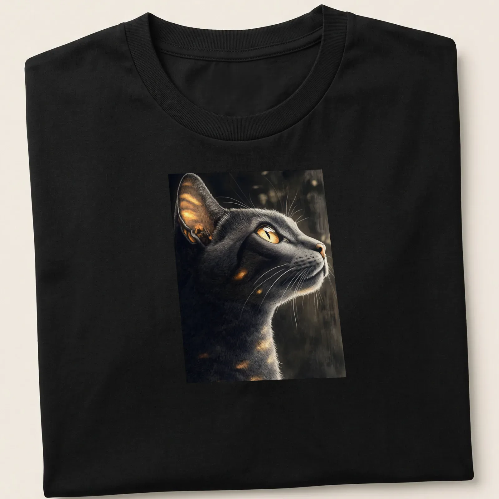 Realistic print of an Abyssinian cat with golden eyes in moonlight — printed on a unisex t-shirt