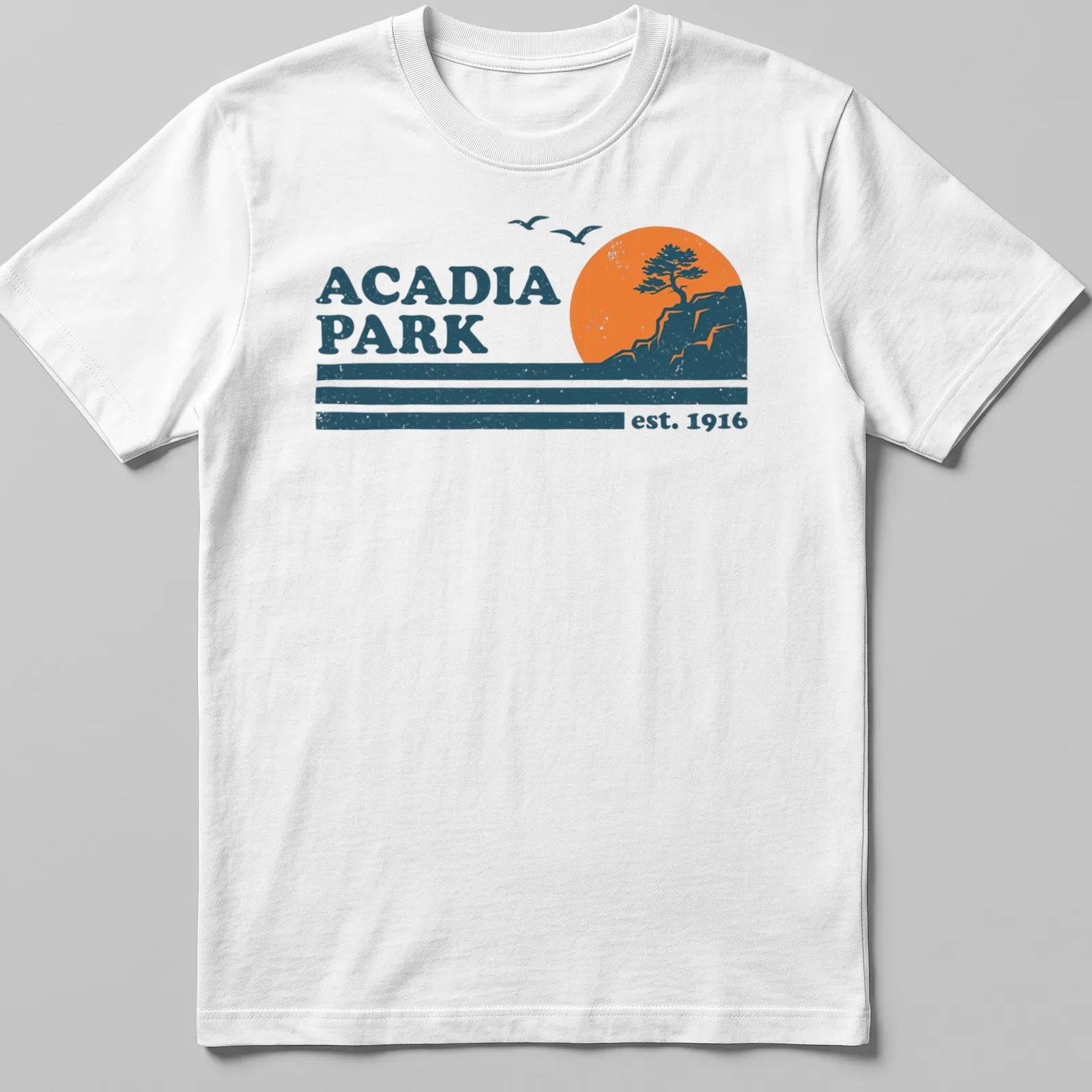 Retro distressed Acadia Park T-shirt featuring tree and cliff landscape — printed on a unisex t-shirt