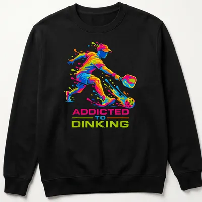 Colorful illustration of a pickleball player with dynamic splash art and text — printed on a unisex sweatshirt