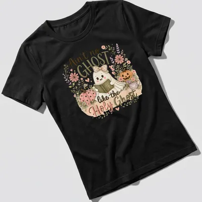 Cute kawaii ghost reading a Bible with pastel colors and playful text — printed on a women's shirt
