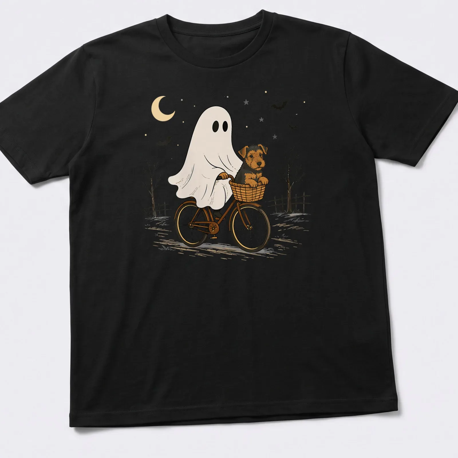 Cartoon Airedale Terrier ghost riding a bicycle in Halloween colors — printed on a unisex t-shirt