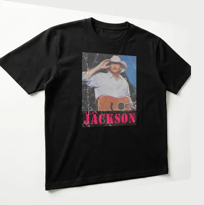 Vintage distressed Alan Jackson t-shirt featuring a guitar illustration — printed on a unisex t-shirt (angled view)