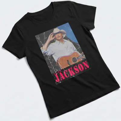 Vintage distressed Alan Jackson t-shirt featuring a guitar illustration — printed on a women's shirt