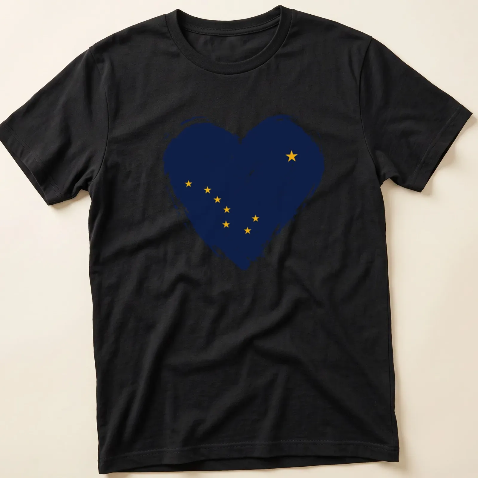 Distressed print of Alaska flag in heart shape, navy blue and yellow — printed on a unisex t-shirt