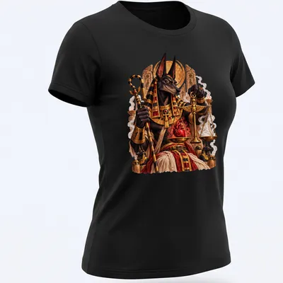 Intricate illustration of Anubis weighing a heart on sacred scales in gold, black, and red — printed on a women's shirt