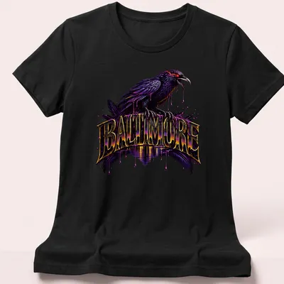 Vibrant graphic tee featuring a raven and 'BALTIMORE' in bold lettering. — printed on a women's shirt