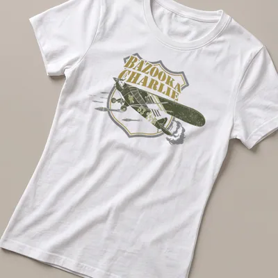 Vintage bomber aircraft design with BAZOOKA CHARLIE text in retro style — printed on a women's shirt