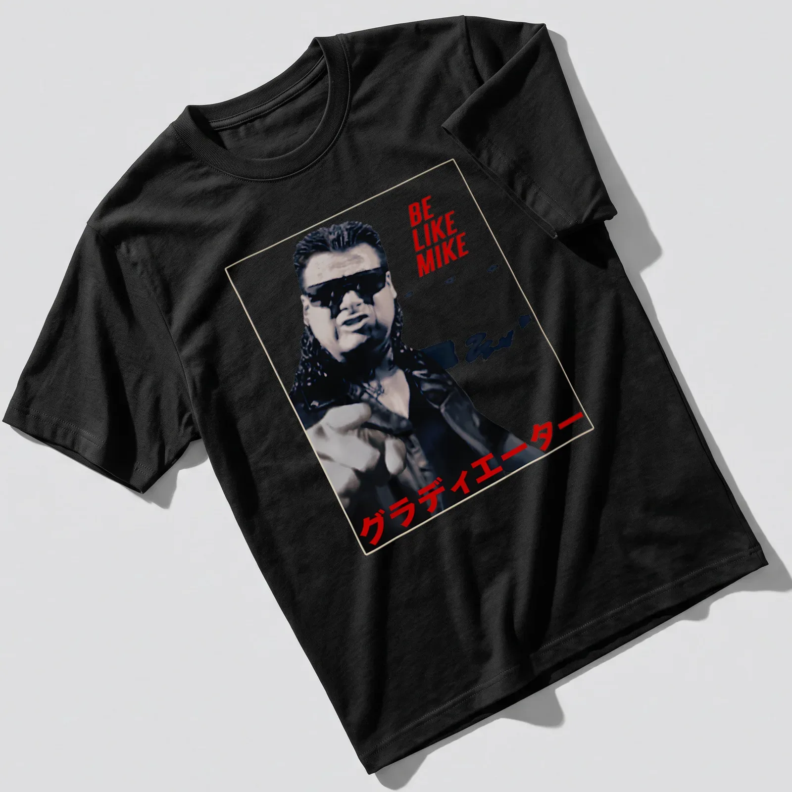 Bold graphic tee featuring wrestler with text 'BE LIKE MIKE グラディエーター' in red, black, and white. — printed on a unisex t-shirt