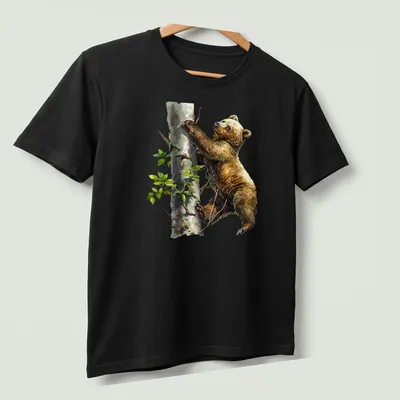 Watercolor design of a bear cub climbing a tree in soft colors — printed on a unisex t-shirt (angled view)