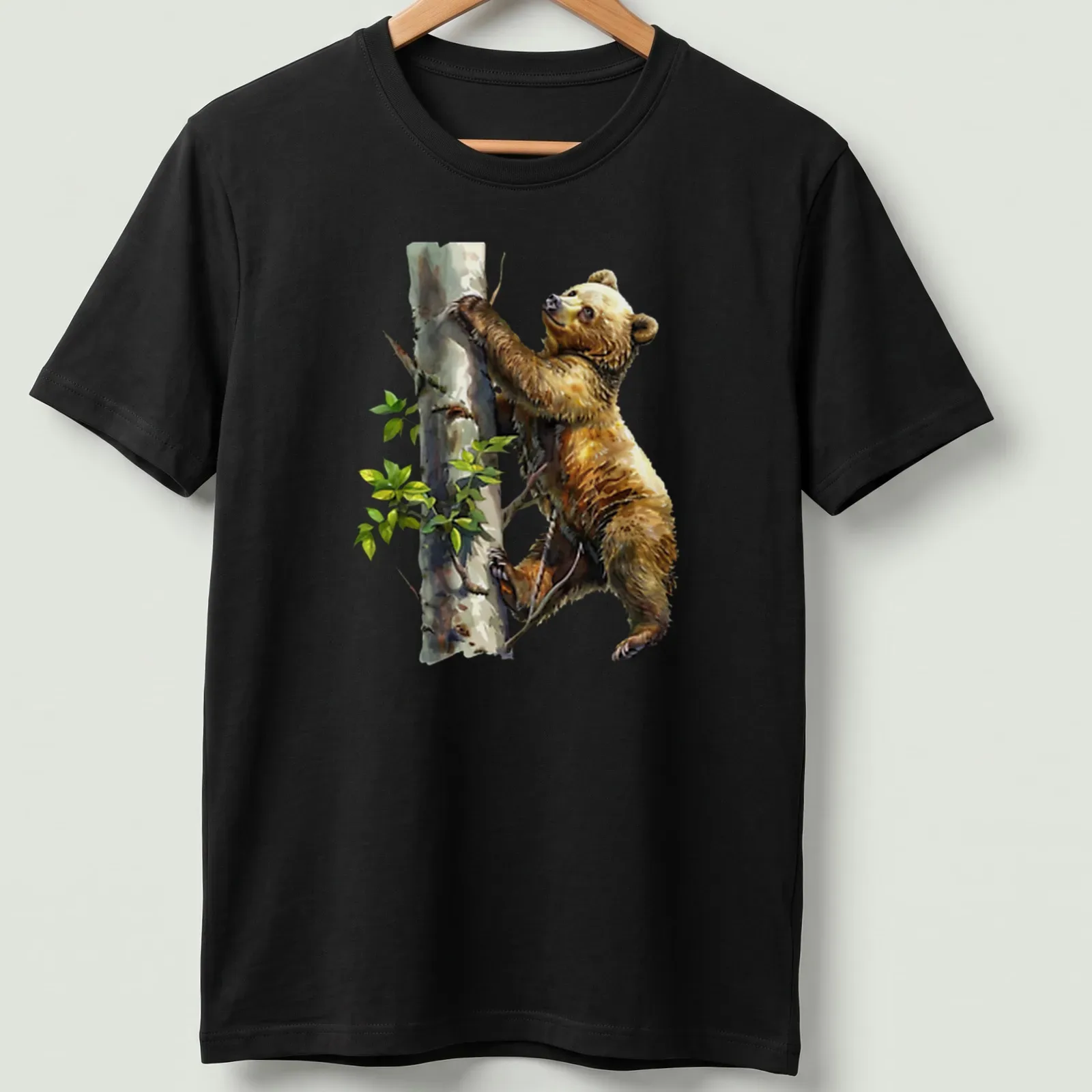 Watercolor design of a bear cub climbing a tree in soft colors — printed on a unisex t-shirt