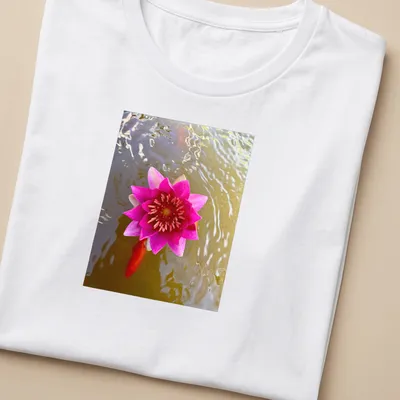 Natural photography of a pink water lily in a tranquil pond setting — printed on a women's shirt