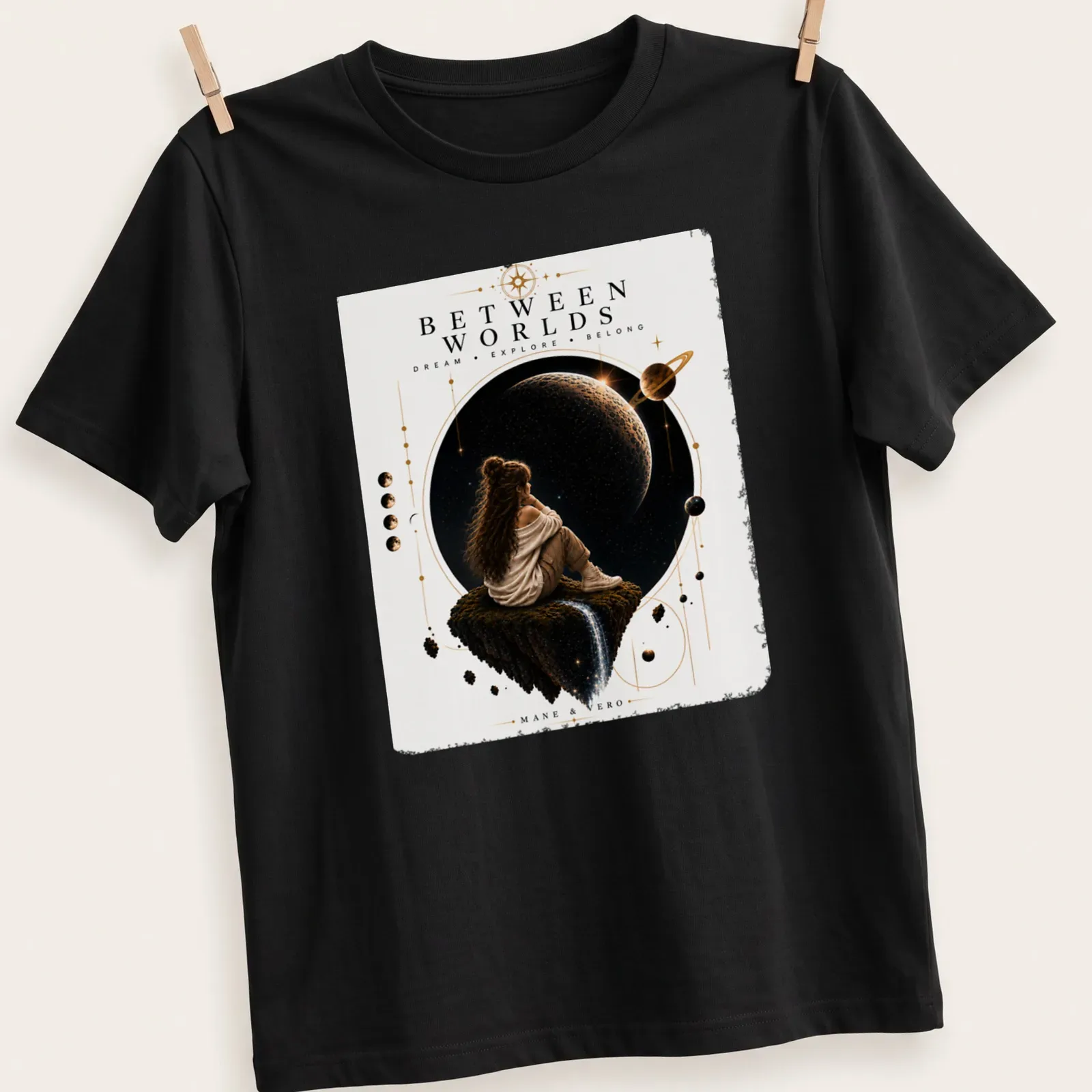 Silhouette of a girl on a floating rock in space with cosmic colors and inspirational text — printed on a unisex t-shirt