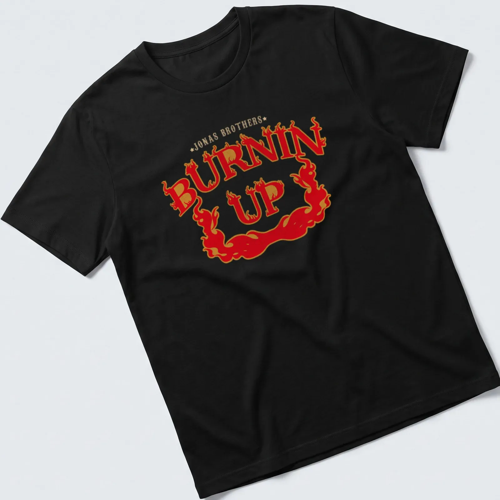 Vintage design featuring flames and Jonas Brothers Burnin Up text — printed on a unisex t-shirt