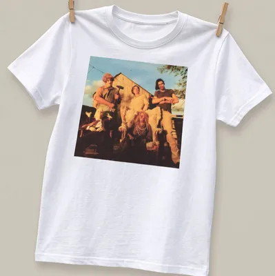 Vintage horror scene t-shirt featuring characters from a horror movie with text But The Saw