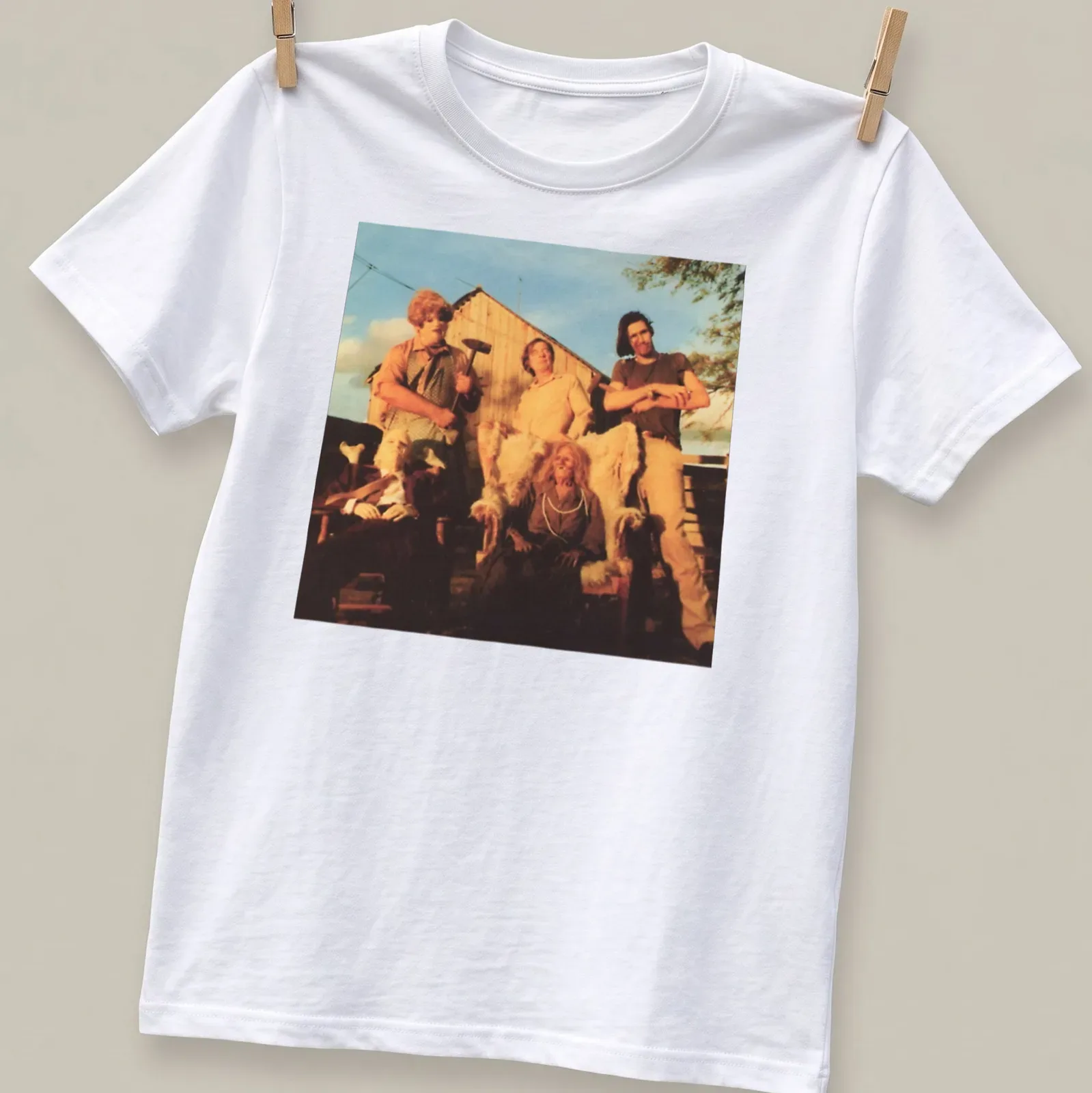 Vintage horror scene t-shirt featuring characters from a horror movie with text But The Saw — printed on a unisex t-shirt