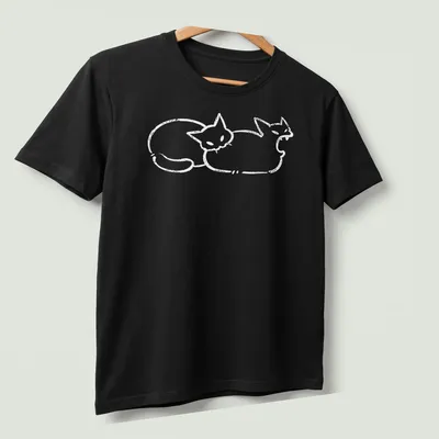 Simple line-art of a cat humorously biting a butt in white — printed on a unisex t-shirt (angled view)
