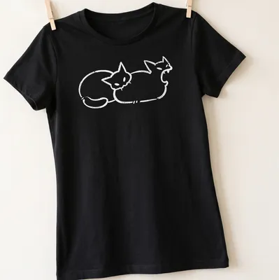 Simple line-art of a cat humorously biting a butt in white — printed on a women's shirt