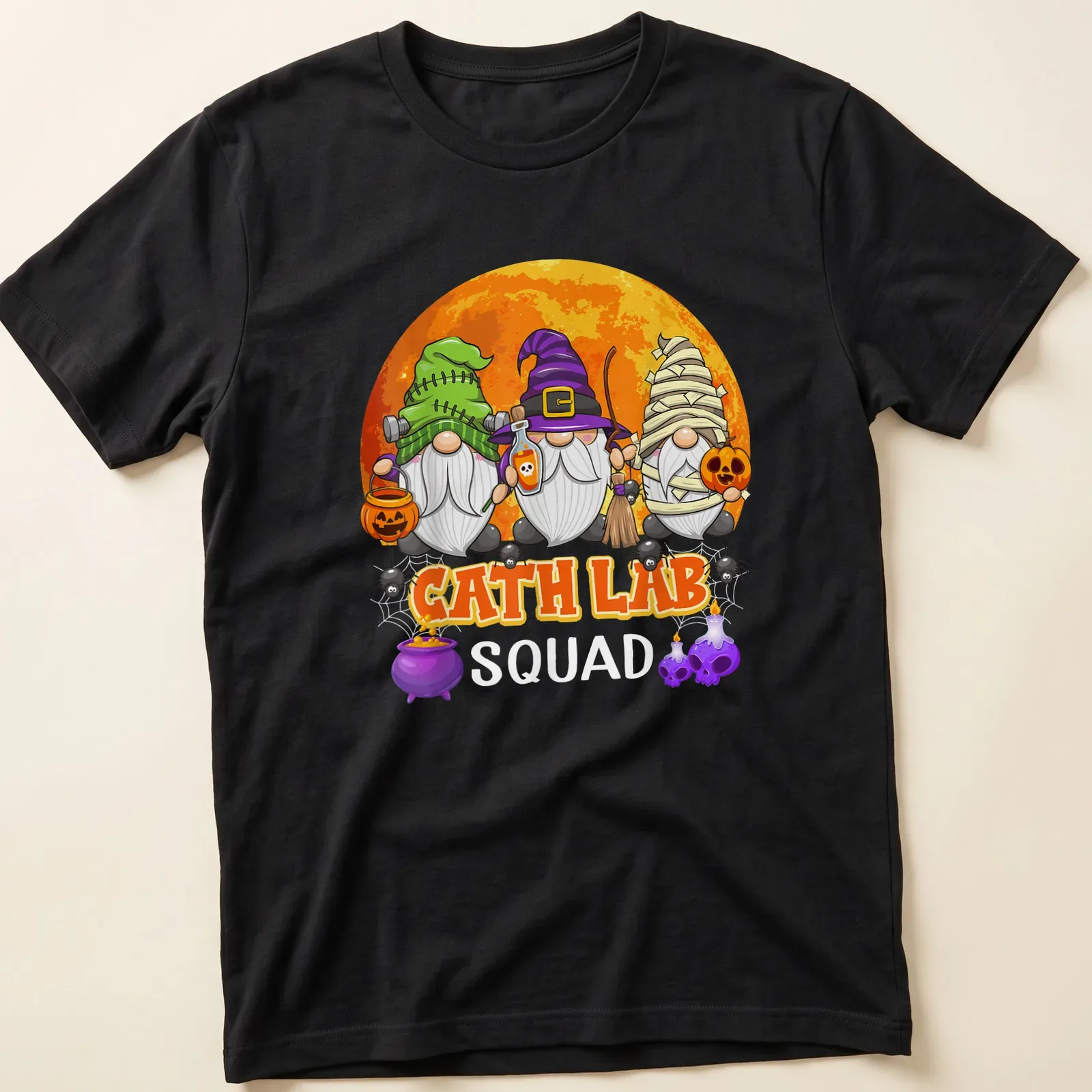 Cartoon Halloween gnomes with CATH LAB SQUAD text in vibrant colors — printed on a unisex t-shirt