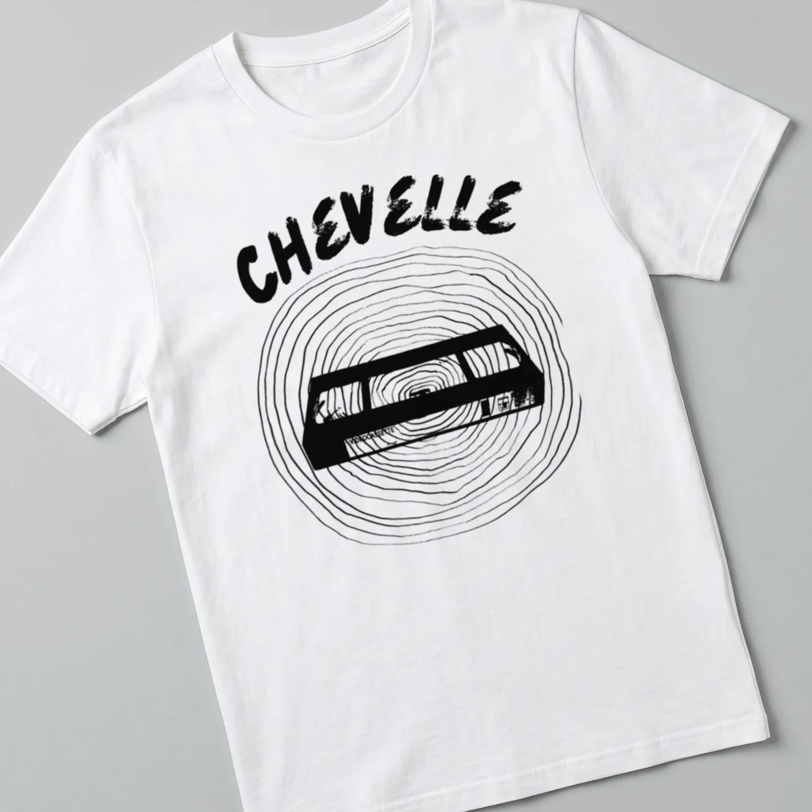 Minimal line-art design of a vintage cassette tape with Chevelle text — printed on a unisex t-shirt