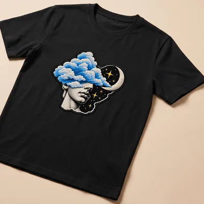 Surreal T-shirt depicting a head filled with clouds and celestial elements in blue, black, gold, and white. — printed on a unisex t-shirt