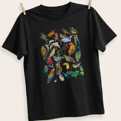 Vibrant illustration of various birds in multiple colors on a — printed on a unisex t-shirt