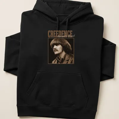 Vintage style t-shirt featuring the text 'CREEDENCE Clearwater Revival' in brown and beige — printed on a unisex hoodie