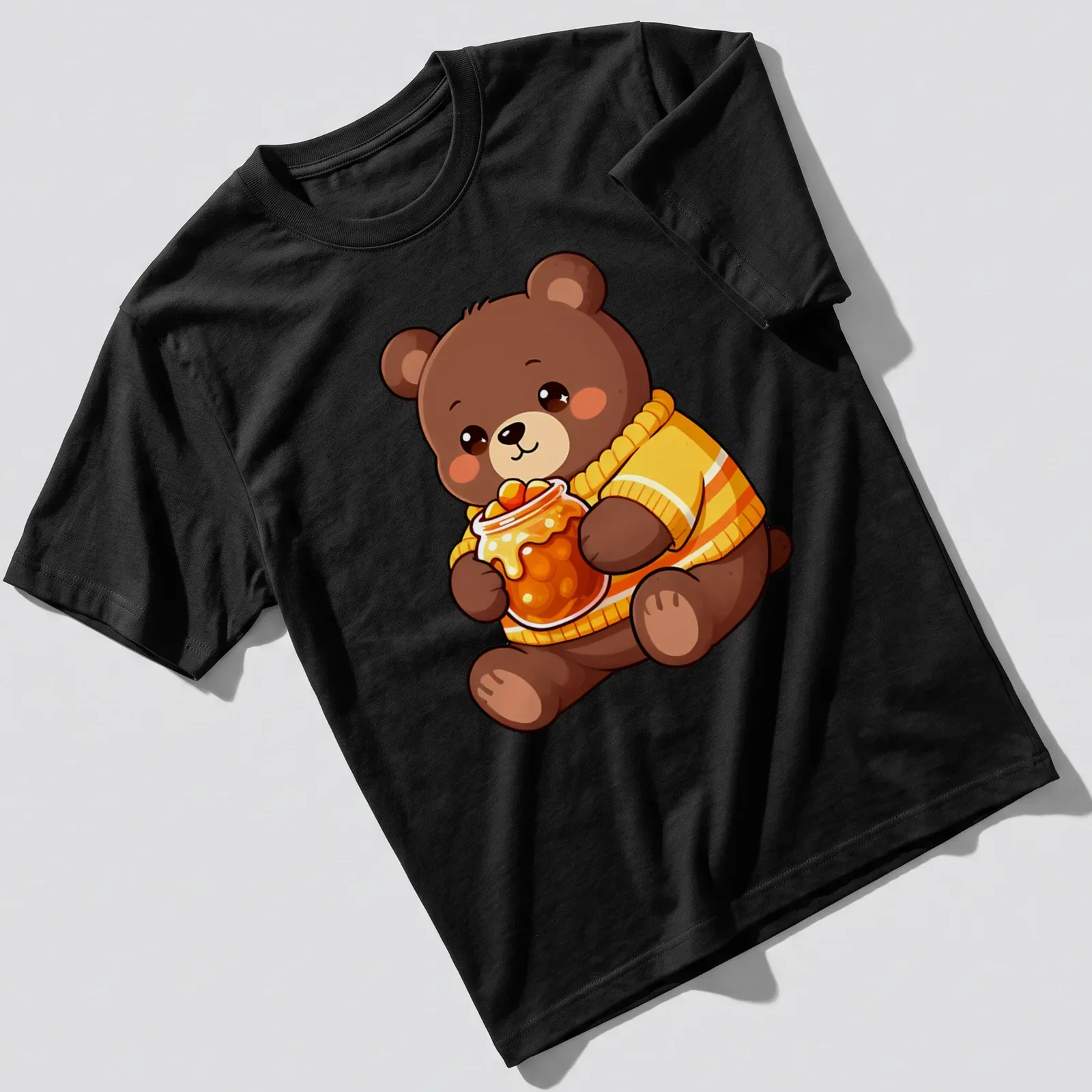 Kawaii style bear cub holding a jar of candy corn in brown and orange — printed on a unisex t-shirt