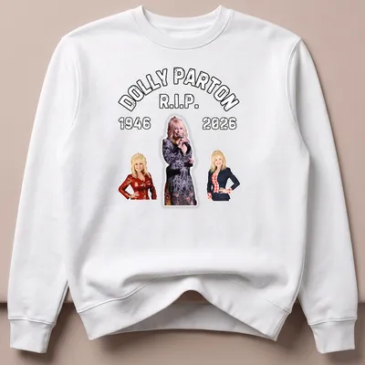 Bold retro tribute t-shirt featuring Dolly Parton's name and years 1946-2026 — printed on a unisex sweatshirt