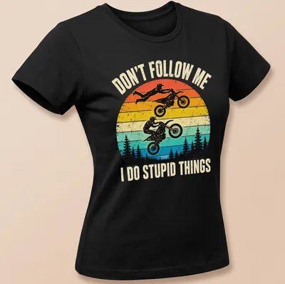 Retro distressed motocross t-shirt featuring riders and humorous text — printed on a women's shirt