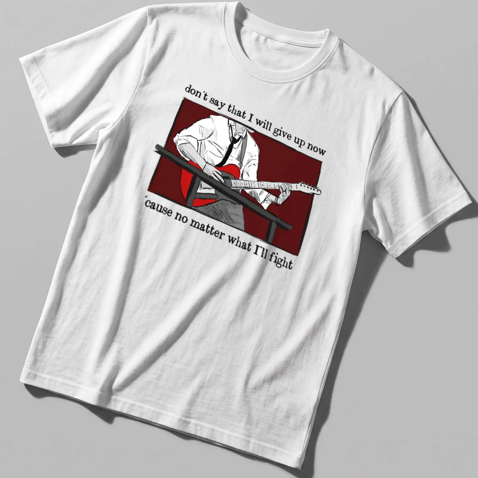 Illustrative design featuring a person playing guitar with inspirational text — printed on a unisex t-shirt