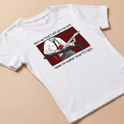Illustrative design featuring a person playing guitar with inspirational text — printed on a women's shirt