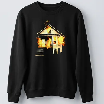 Illustrative design of a house on fire in orange, yellow, and black — printed on a unisex sweatshirt