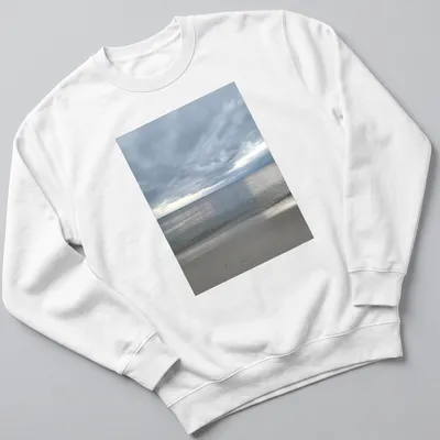 Photographic print of a dramatic bay view in gray, blue, and beige hues — printed on a unisex sweatshirt