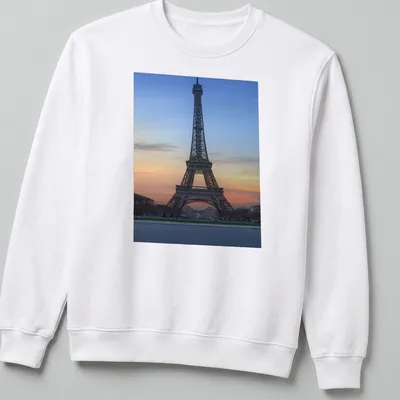 Photographic print of the Eiffel Tower at sunset in blue, orange, pink, and gray. — printed on a unisex sweatshirt