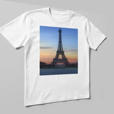 Photographic print of the Eiffel Tower at sunset in blue, orange, pink, and gray. — printed on a unisex t-shirt (angled view)