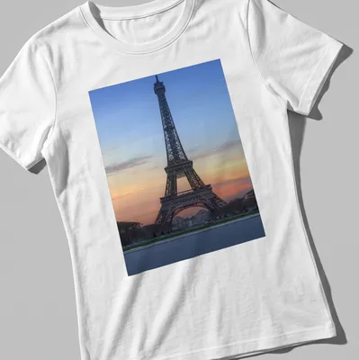 Photographic print of the Eiffel Tower at sunset in blue, orange, pink, and gray. — printed on a women's shirt