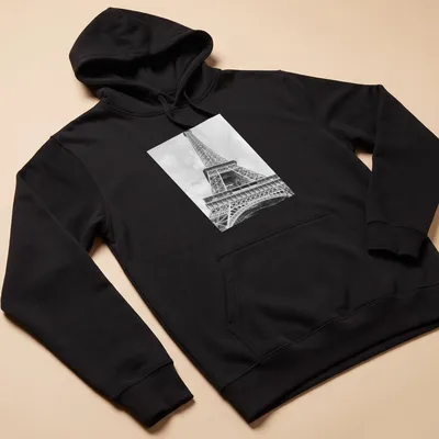 Black and white photograph of the Eiffel Tower on a — printed on a unisex hoodie