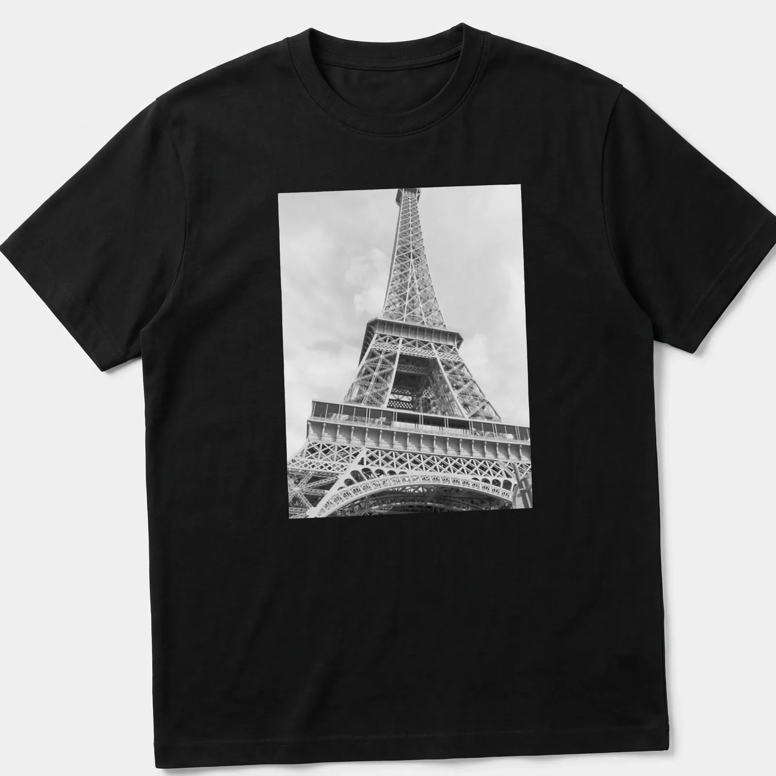 Black and white photograph of the Eiffel Tower on a — printed on a unisex t-shirt
