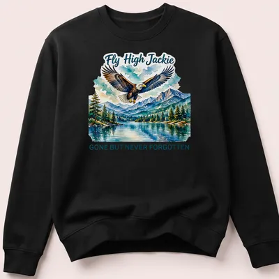 Watercolor print T-shirt featuring a bald eagle and the text Fly High Jackie GONE BUT NEVER FORGOTTEN — printed on a unisex sweatshirt