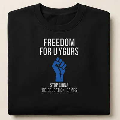 Bold graphic T-shirt with text calling for Uyghur freedom and a raised fist — printed on a unisex sweatshirt