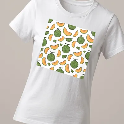 Seamless pattern of cantaloupe melons with green leaves on white background. — printed on a women's shirt