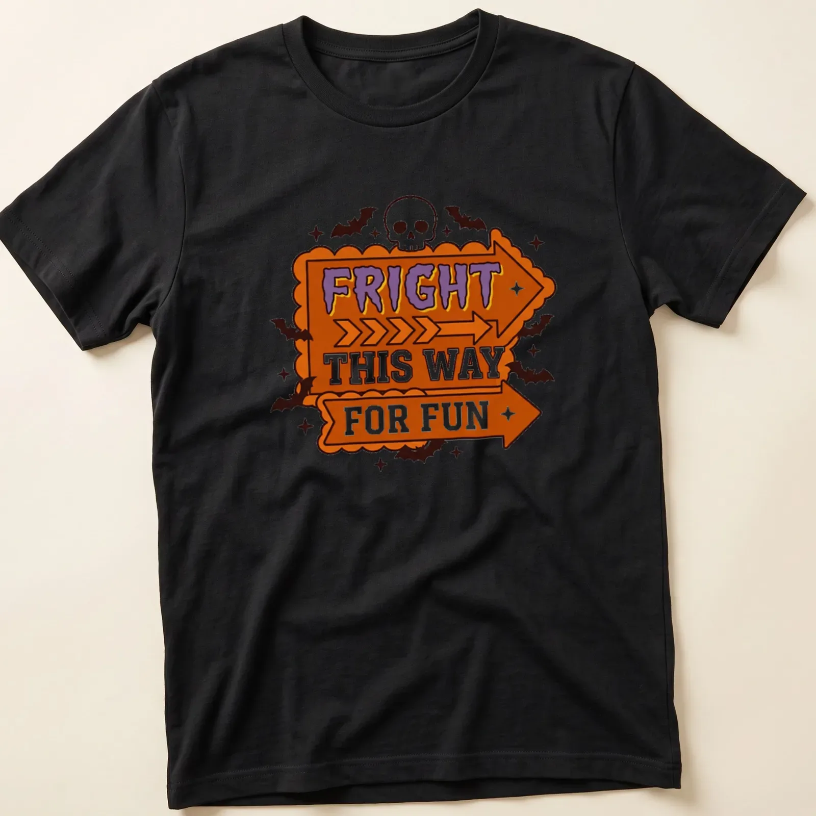 Bold cartoon Halloween shirt with skulls and arrows in orange, purple, black, and white — printed on a unisex t-shirt