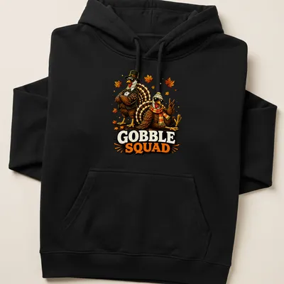 Vintage cartoon t-shirt featuring funny turkeys with the words Gobble Squad — printed on a unisex hoodie