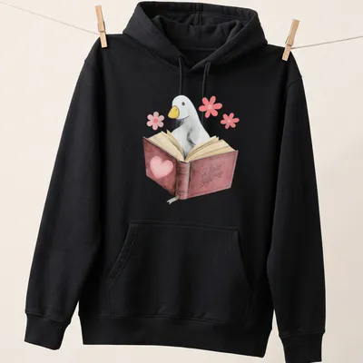Kawaii illustration of a goose reading a book with colorful flowers — printed on a unisex hoodie