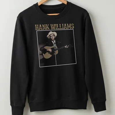Vintage graphic of Hank Williams holding a guitar with text above — printed on a unisex sweatshirt
