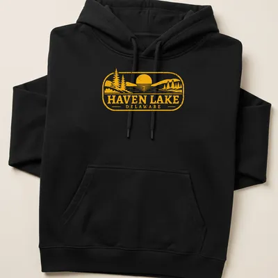 Vintage scene of a lake at sunset with trees, printed in yellow and black — printed on a unisex hoodie