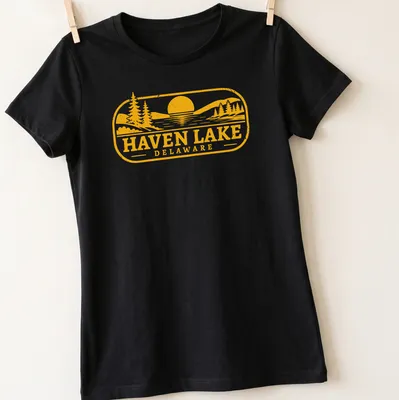 Vintage scene of a lake at sunset with trees, printed in yellow and black — printed on a women's shirt