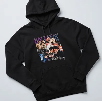 Vintage hockey-themed shirt featuring players and vibrant text — printed on a unisex hoodie