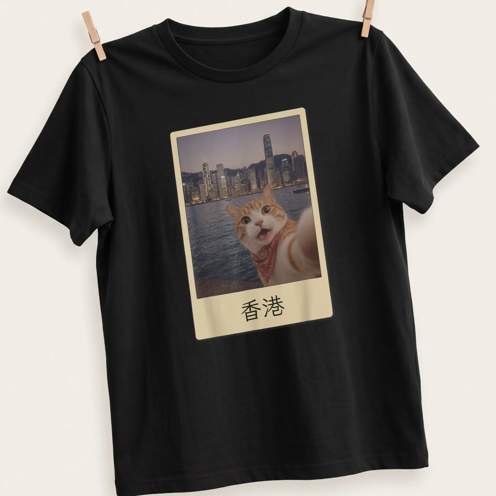 Orange tabby cat selfie with Hong Kong cityscape, colorful photographic print — printed on a unisex t-shirt